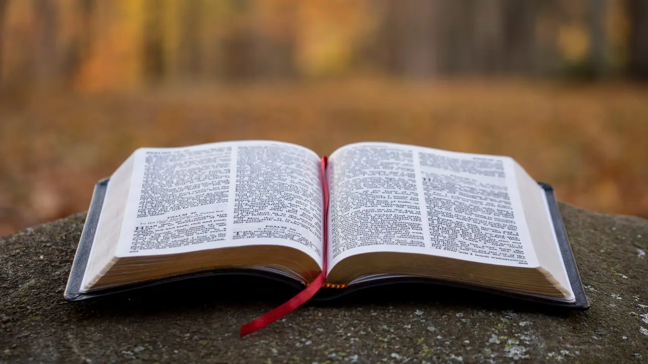 Christian reading the Bible and praying while seeking to live a faith-filled life through biblical principles, spiritual growth, and daily devotion